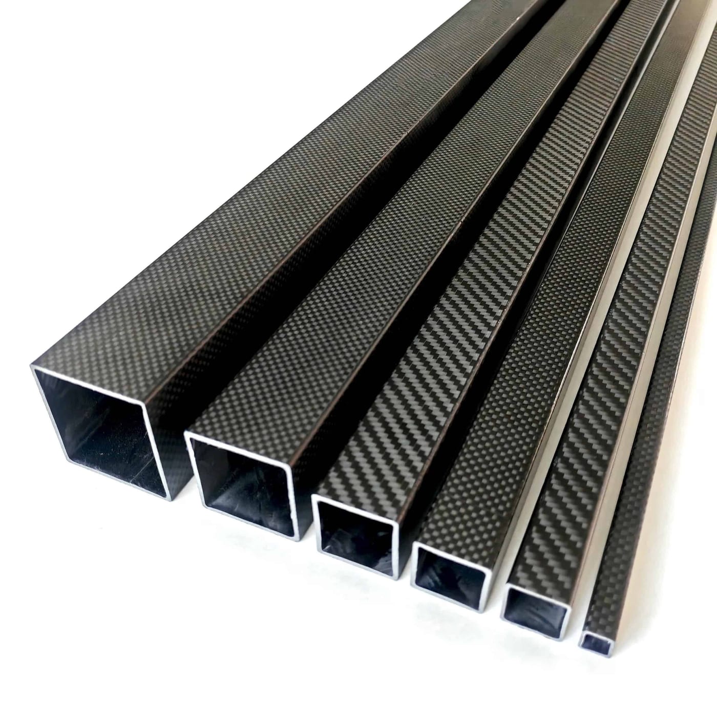 Roll-wrapped carbon fiber tube